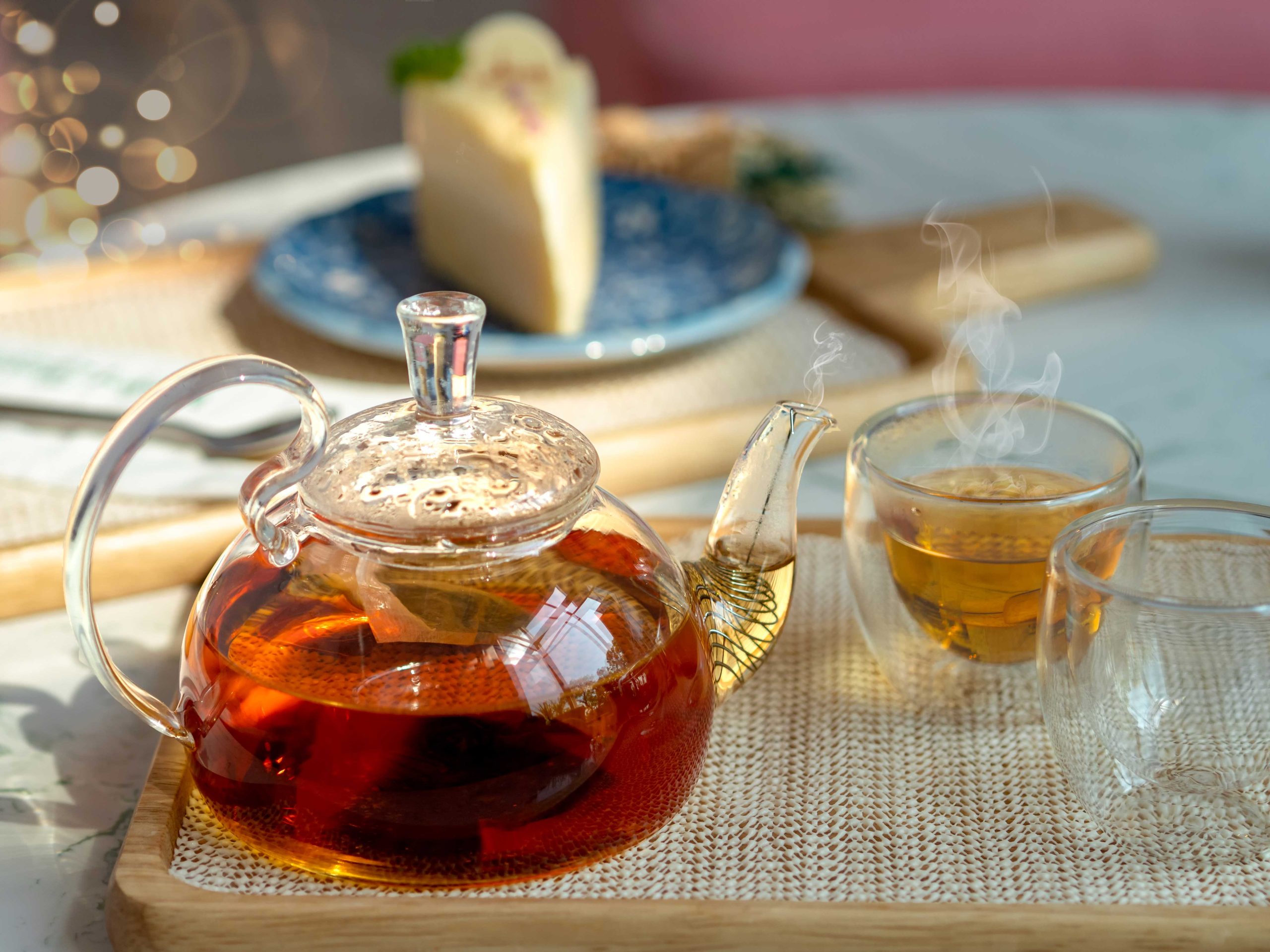 Afternoon tea in cups with teapot, teatime concepts. CREDIT PHOTO: https://lustinherworld.com/